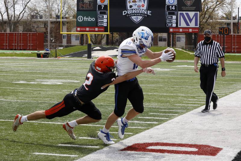 St. Charles North wide receiver Ryan Doherty tries to stay inbounds Saturday, April 24, 2021 during their conference game against Wheaton Warrenville South at NIU.