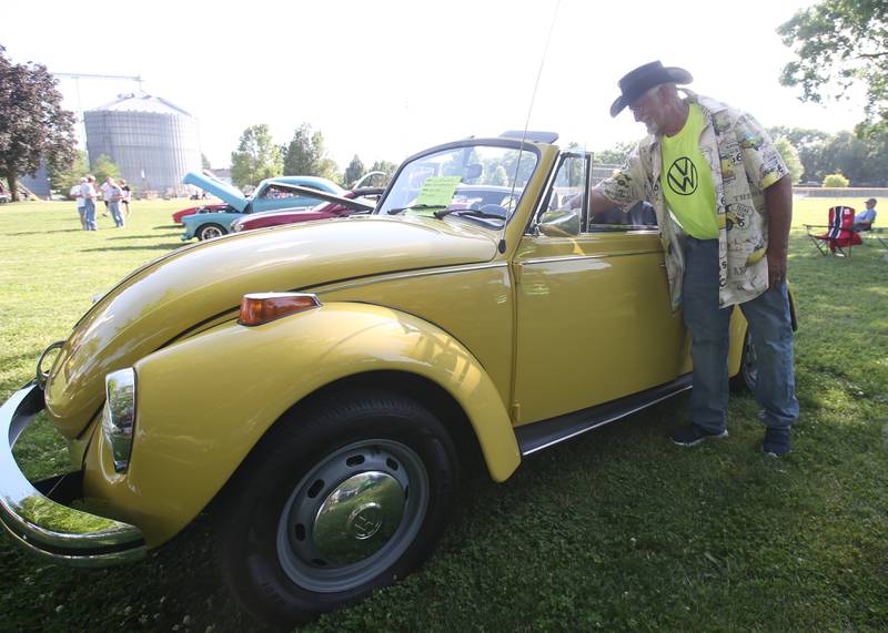 Larry Kohr of La Salle shows off his Volkswagen Super Convertible during the Utica Fire Department Car Show on Saturday, June 21, 2025 at Carey Memorial Park in Utica.