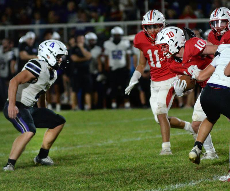 Oregon's Keaton Salsbury (10) tries to find running room as Dixon's Landon Knigge (4) waits to make the tackle on Friday, Sept. 26, 2025 at Landers-Loomis Field in Oregon.