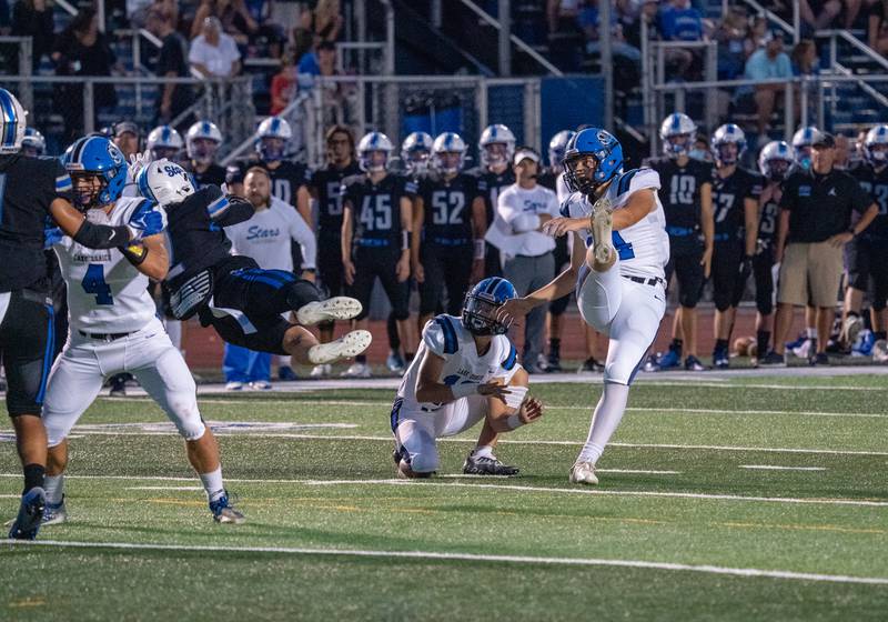 Lake Zurich's Danny Vuckovic (14) attempts a field goal kick against St. Charles North during a football game at St. Charles North High School on Friday, Sep 2, 2022.