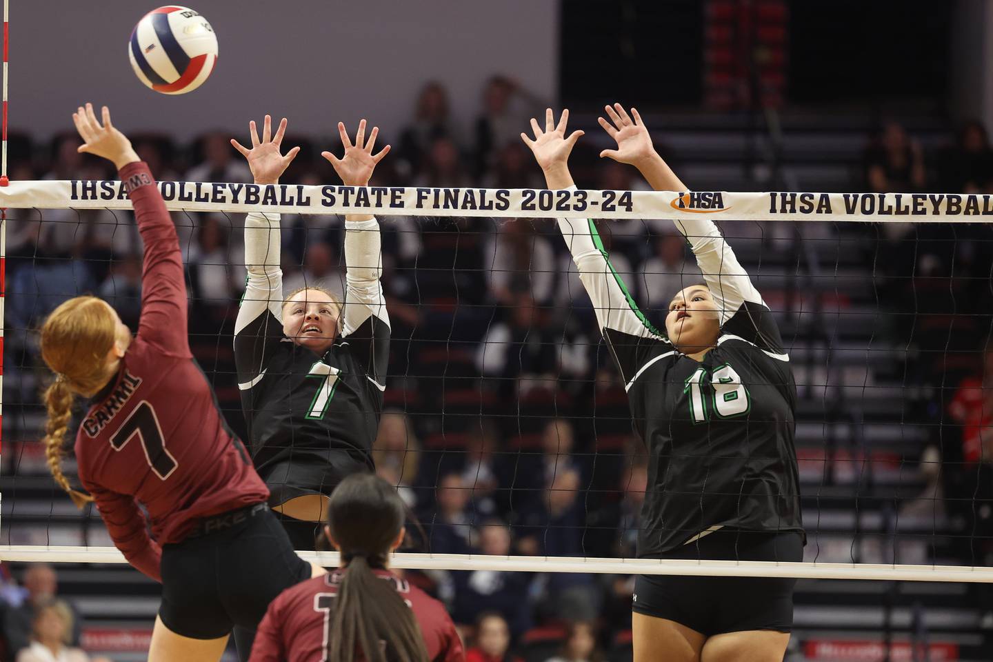Rock Falls’ Denali Stonitsch, left, and Ari Reyna go for the block against Carmi-White County in the Class 2A Volleyball Third Place match on Saturday, Nov. 11, 2023 in Normal.
