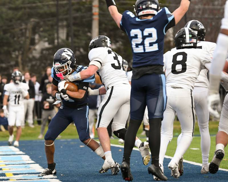Nazareth Academy's Charles Calhoun, left scores a touchdown during the overtime portion of the 6A semifinals game while taking on Fenwick on Saturday Nov. 22, 2025, held at Nazareth Academy High School in La Grange Park.