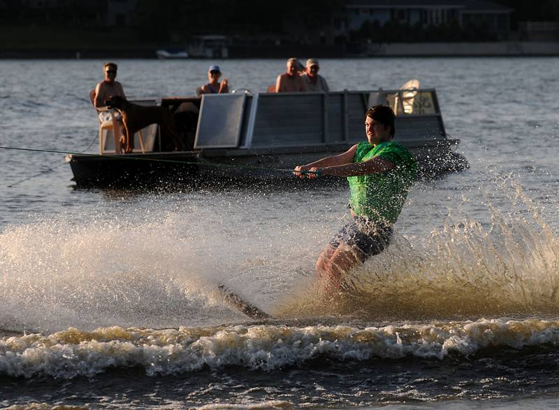 Stanley Nowiki water skis Tuesday, June 21, 2022, as part of the Wonder Lake Water Ski Show Team and Northern Illinois Special Recreation Association’s performance on Wonder Lake. The performance was the end of the team’s learn to ski clinic. Members of ski team have constructed adaptive water ski equipment, which has proven year after year to be successful in allowing every participant to be able to water ski.