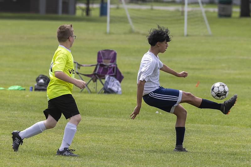Sterling United soccer’s Adan Molina handles the ball against a player for the Quad City Strikers Sunday, May 19, 2024 at Scheid Park in Sterling.