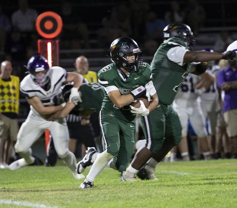 Rock Falls’ Austin Casteneda picks up yards against Rockford Lutheran Friday, Sept. 20, 2024, at Hinders Field in Rock Falls.