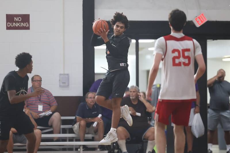 A Minooka player pulls in the rebound against Marmion at the 37th Morris Boys Shootout on Tuesday, June 25, 2024.