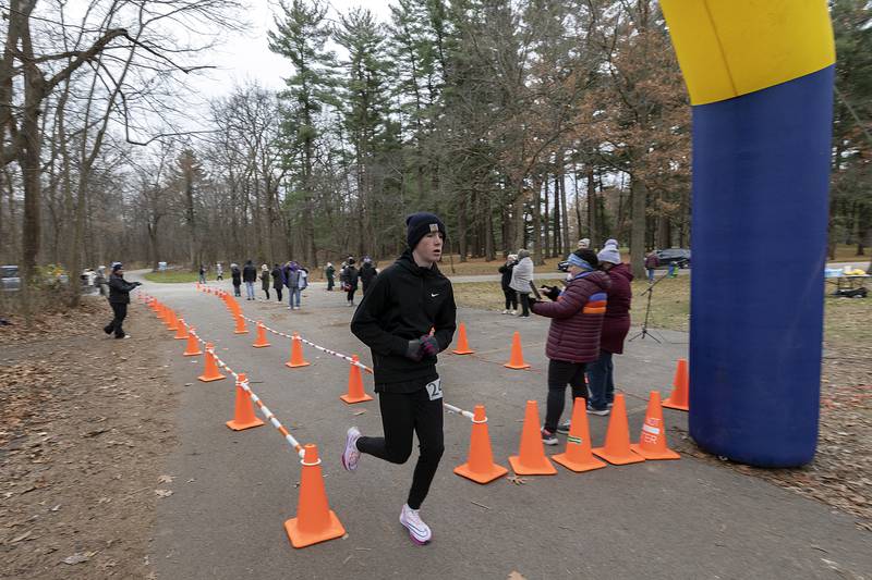 Averick Wiseman crosses the finish line to take second  Thursday, Nov. 28, 2024, during St. Anne’s Turkey Trot 5K.
