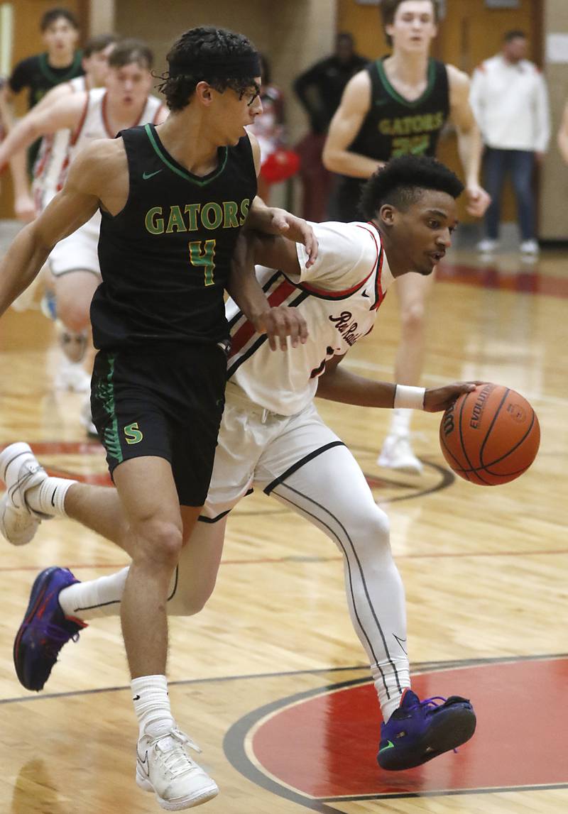 Huntley's Bryce Walker drives to the basket against Crystal Lake South's AJ Demirov during a Fox Valley Conference boys basketball game Tuesday, Feb.6, 2024, at Huntley High School.