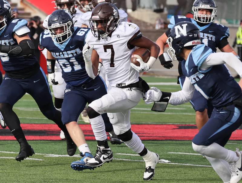 Joliet Catholic's HJ Grigsby breaks through the Nazareth defense Saturday, Nov. 25, 2023, during their IHSA Class 5A state championship game in Hancock Stadium at Illinois State University in Normal.