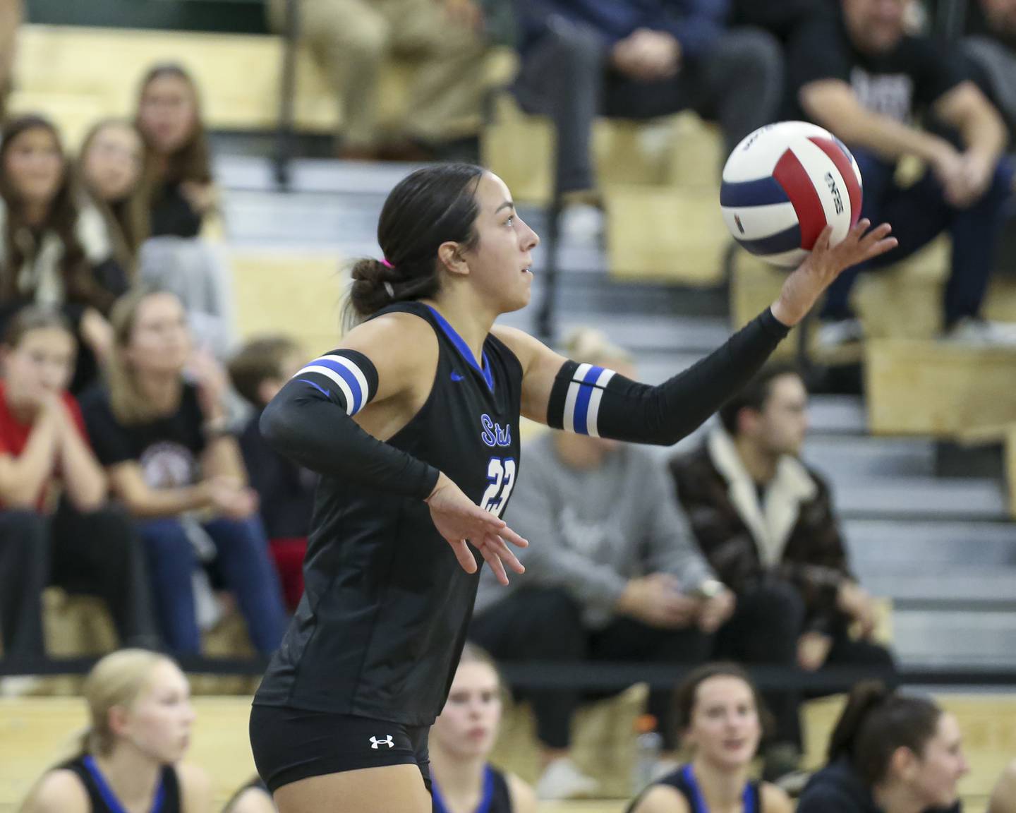 St Charles North's Haley Burgdorf (23) serves during Class 4A Glenbard West Sectional final volleyball match between St Charles North at Benet. Nov 6, 2025 in Glen Ellyn.