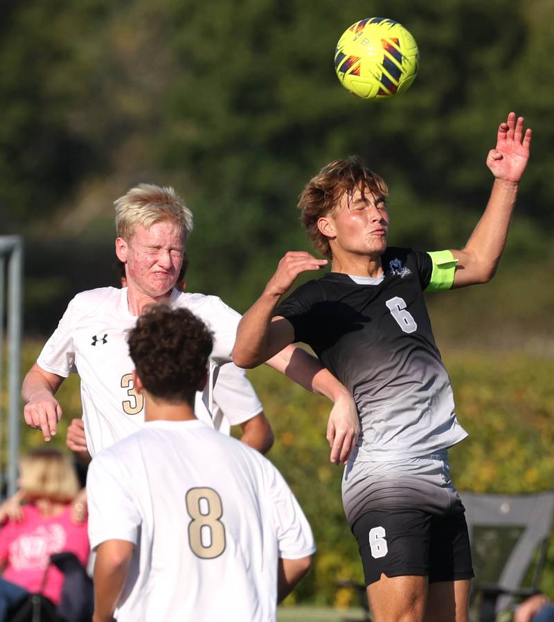 Sycamore's Paxton Nicol (left) and Kaneland's Noah McKittrick go up for a header during their game Wednesday, Sept. 16, 2025, at Kaneland High School in Maple Park.