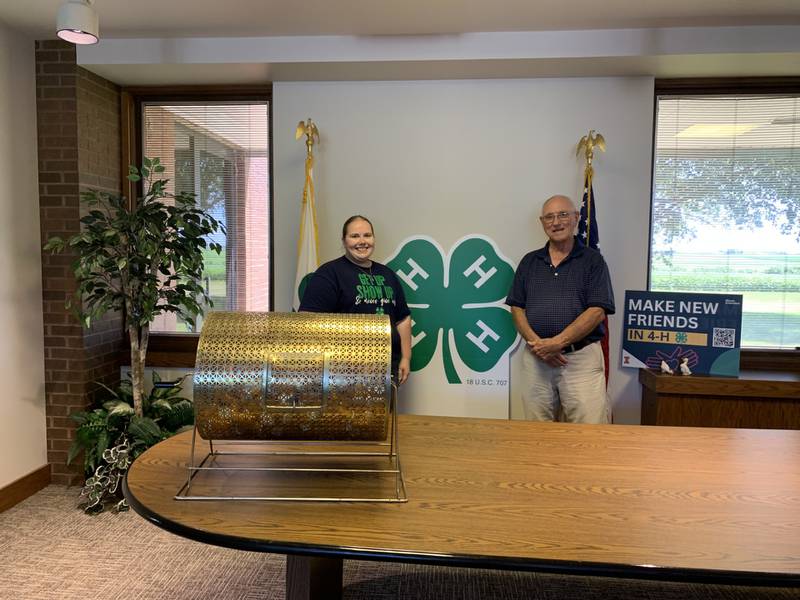 Jessica Carlson, 4-H alumna (left), and Francis Morse, Friends of 4-H and Extension, draw the winning tickets for the annual Friends of 4-H & Extension cash raffle to support Bureau County Extension and 4-H educational programming.