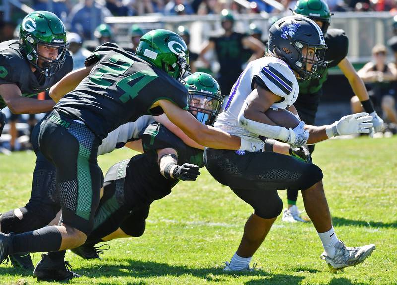 Downers Grove North's Noah Battle (right) escapes from two Glenbard West tacklers during a game on Sep. 9, 2023 at Glenbard West High School in Glen Ellyn.
Jon Cunningham for Shaw Local News Network