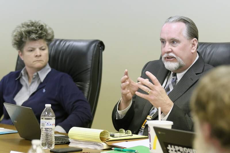 DeKalb School District 428 Superintendent Doug Moeller speaks Tuesday while sitting beside board 
President Victoria Newport before naming Michele Albano DeKalb High School principal in April.