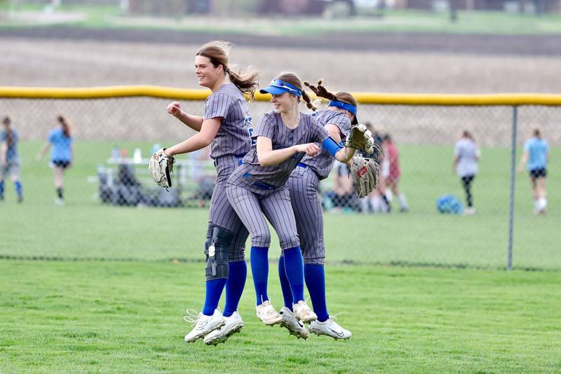 Princeton outfielders Ellie Harp (from left), Caroline Morris and Addi Parry get ready for the next inning with a warm-up bump during Tuesday's game with Newman.