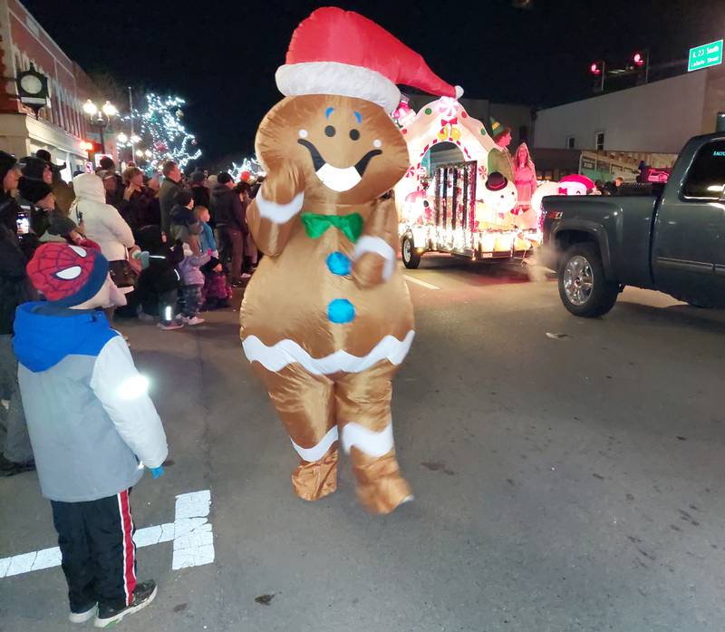 A gingerbread character greets parade goers Friday, Nov. 24, 2023, during the Festival of Lights in Ottawa.