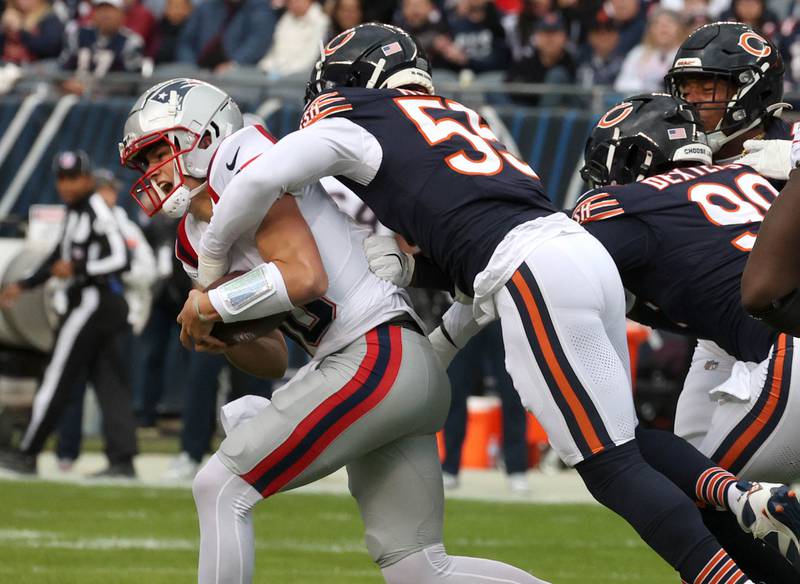 Chicago Bears defensive end Jacob Martin sacks New England Patriots quarterback Drake Maye during their game Sunday, Nov. 10, 2024, at Soldier Field in Chicago.
