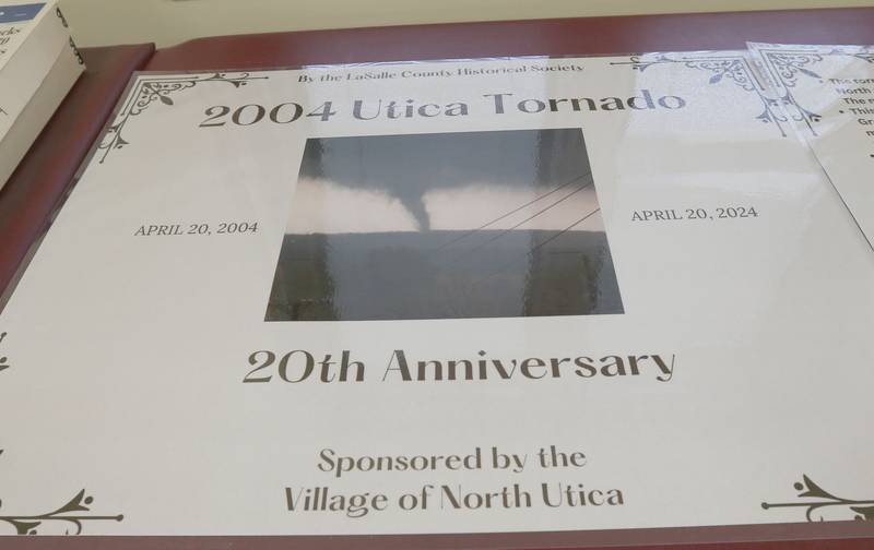 A view of the cover of a timeline display from an exhibit honoring the 20th anniversary of the 2004 Utica Tornado inside the Utica Community Building on Saturday, April 20, 2024. The exhibit is made by the La Salle County Historical Society and will be on display at the La Salle County Historical Society Heritage Center until June 2nd in Utica.