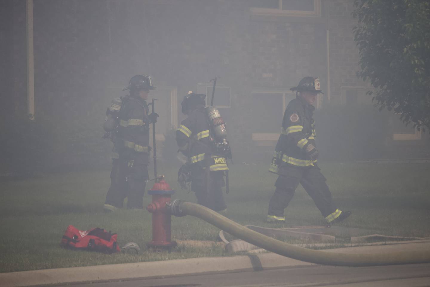 Joliet firefighters at the scene of a fire at an apartment building on Tuesday, June 10, 2025, near Essington Road in Joliet.