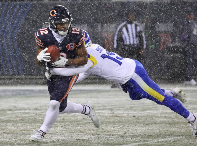 Chicago Bears returner Devin Duvernay tries to break away from Los Angeles Rams’ Xavier Smith on a punt return Sunday, Jan. 18, 2026, during their NFC divisional playoff matchup at Soldier Field in Chicago.