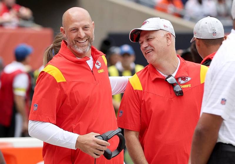 Matt Nagy, (left) senior assistant and quarterbacks coach for the Kansas City Chiefs and former head coach of the Chicago Bears, smiles on the sidelines before their preseason game against the Bears, Aug. 13, 2022, at Soldier Field in Chicago.