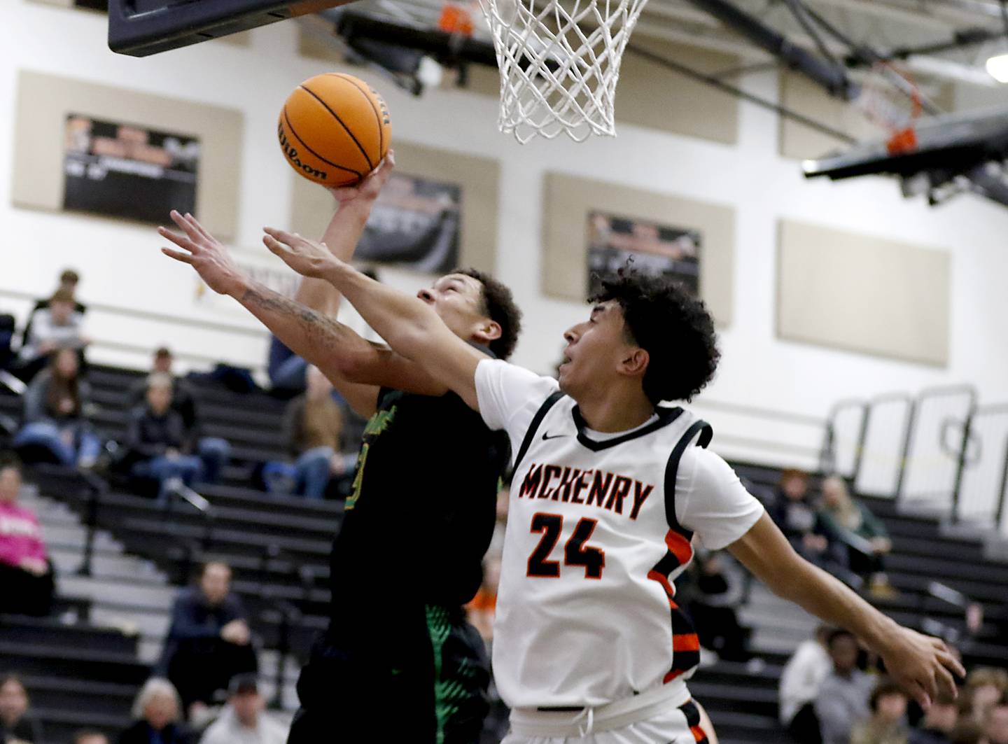 Crystal Lake South's Cooper Buelna drives to the basket against McHenry's Adam Anwar during a Fox Valley Conference boys basketball game on Wednesday, Dec. 11, 2024, at McHenry High School.
