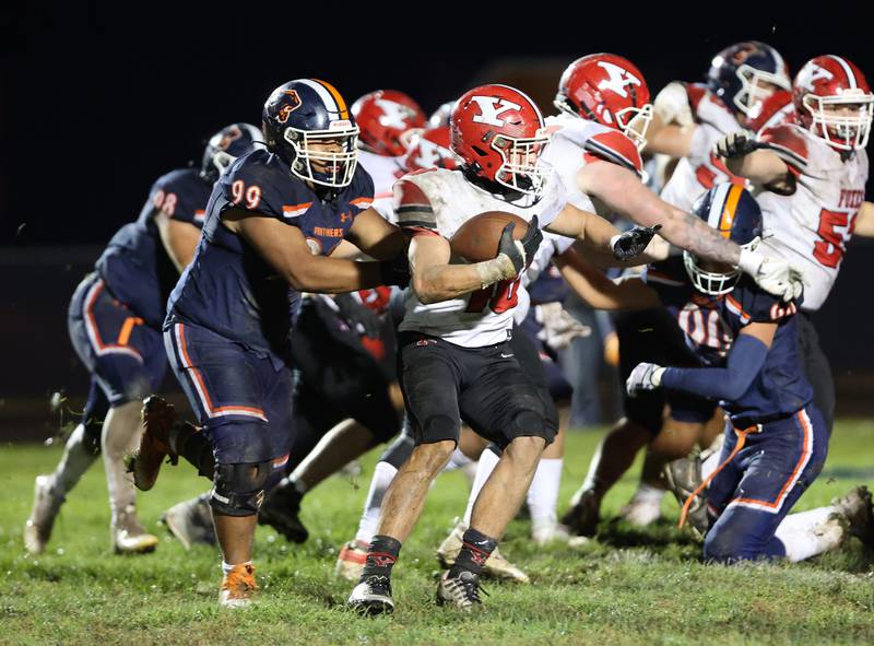 Yorkville’s Luke Zook (10) runs the ball during the boys varsity football game against Oswego on Friday, Oct. 6, 2023 in Oswego.
