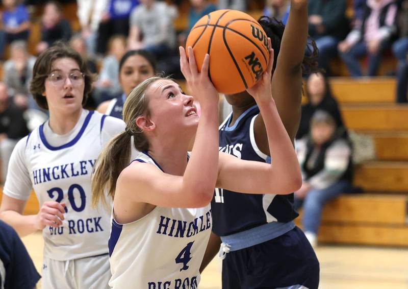 Hinckley-Big Rock's Ameilia Michels goes to the basket against Illinois Math and Science Academy's Cheluchi Chuke during their game Thursday, Jan. 8, 2025, at Hinckley-Big Rock High School.