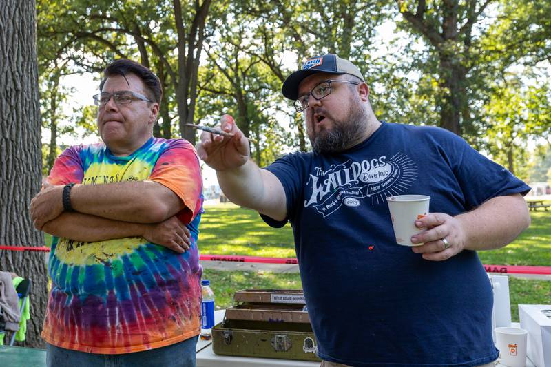 (from left) Doug Haffner and Joe Diaz of the Walldogs talk over strategy for painting of Streator mural on Thursday, Sept. 11, 2025 at City Park in Streator.