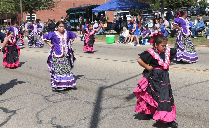 Ballet Folklorico De Colores dancers make their way down South Main Street during the 54th annual Homestead Festival parade on Saturday, Sept. 6, 2025 in Princeton.