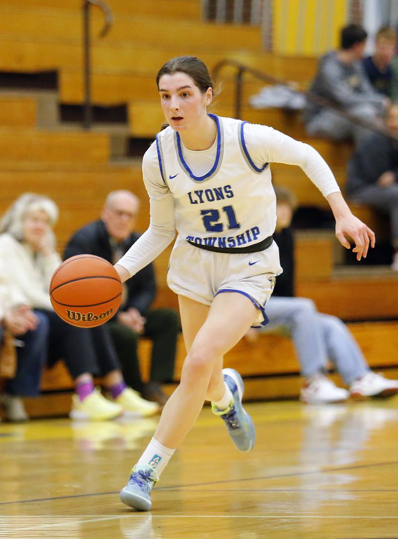 Lyons' All Cesarini (21) brings the ball up court during the girls varsity basketball game between Benet Academy and Lyons Township on Wednesday, Nov. 30, 2022 in LaGrange, IL.
