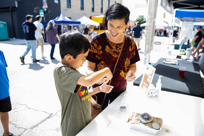 Romeoville residents Eli (8) and Ruth Michalsen enjoy s'mores at the City of Lockport booth during Fire Fest, held in Lockport's Historic District, on August 10, 2024.