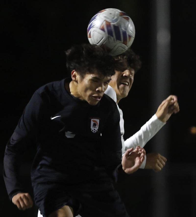 McHenry's Jhosmar Mujica and Huntley's Noah Gomez battle for the ball during a Fox Valley Conference boys soccer match on Thursday, Oct. 9, 2025, at McCracken Field in McHenry.
