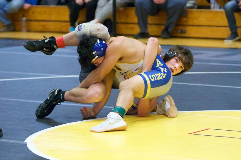 St. Charles East's Lane Robinson wrestles Wheaton North's Devin Medina in the 152-pound championship round at the DuKane Conference at Glenbard North  on Jan. 29, 2022 in Carol Stream.