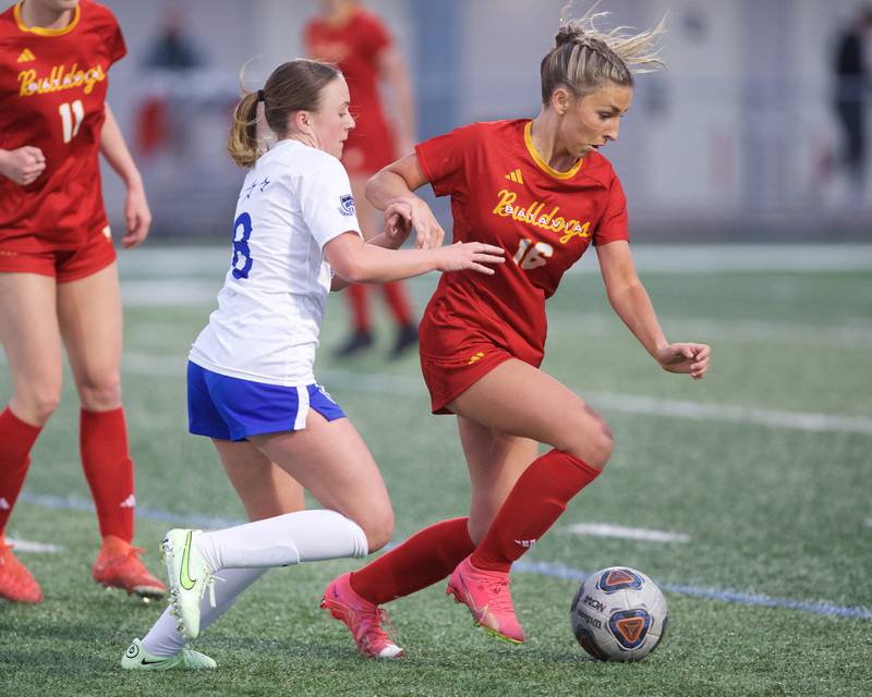 Batavia's Olivia Patrick is pressured by the defense of St. Charles North's Keira  Kelly on Thursday, April 17,2025 in Batavia.