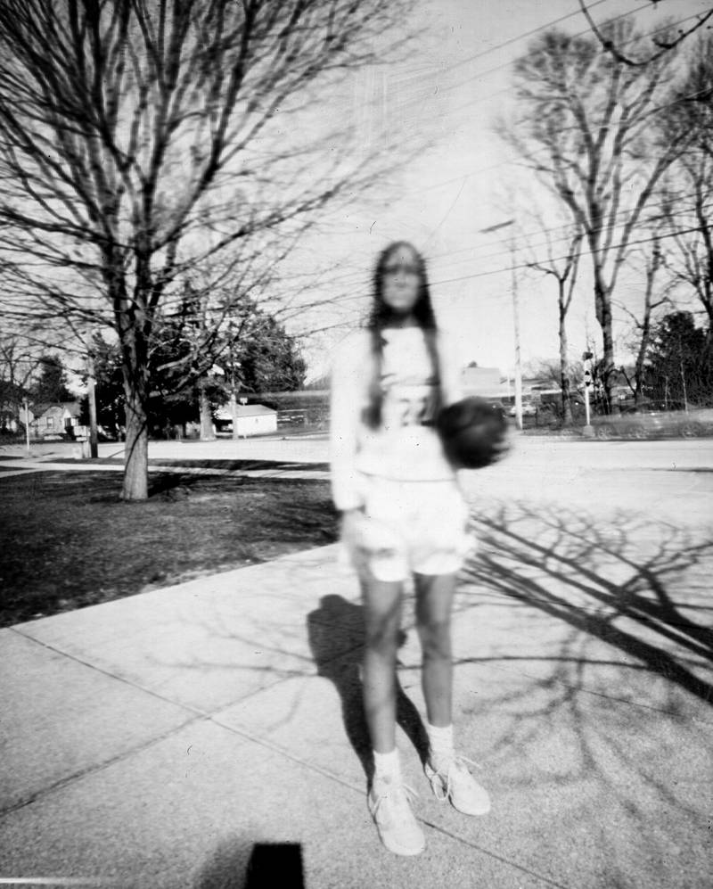 Morrison’s Shelby Veltrop stands outside of the high school for a photo shoot using a pinhole camera.