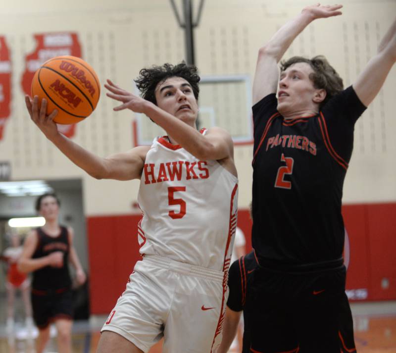 Oregon's Benito Olade (5) shoots as Erie-Prophetstown's Connor Keegan (2) defends during 2A regional action on Monday, Feb. 24, 2025 at the Blackhawk Center in Oregon.
