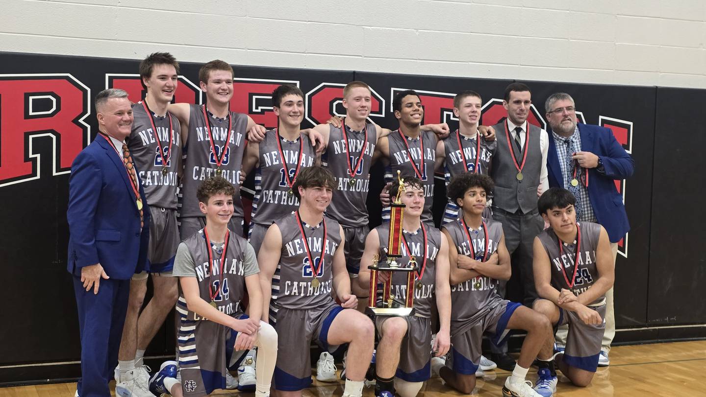 The Newman boys basketball team is pictured after winning the Forreston Holiday Tournament on Friday, Dec. 20, 2025.