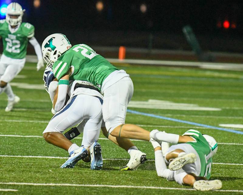 York’s Cole Ostendorf takes down Nazareth Academy Garrett Reese (2) during the second quarter during the game Friday 1, 2023 held in Elmhurst.