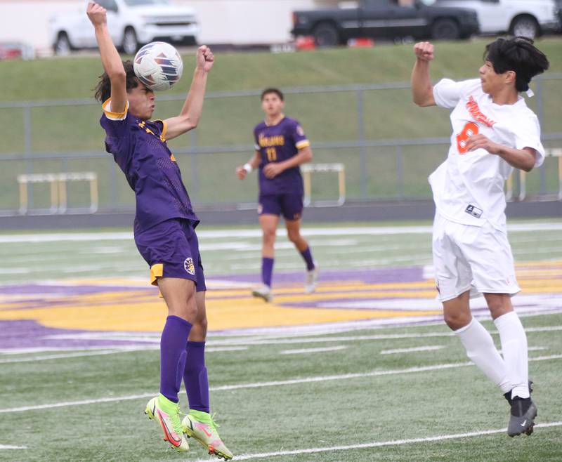 Mendota's Angel Oroczo puts a header on the ball as Winnebago's Brandon Melin defends on Wednesday, Oct. 4, 2023 at Mendota High School.