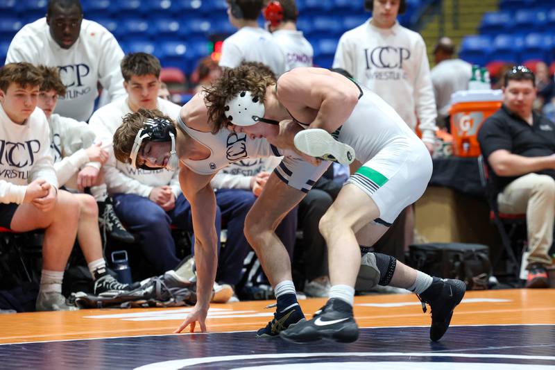 IC Catholic's Jack Hanrahan stays upright as Providence Catholic's Tommy Banas attempts a takedown in the 138-pound match during IC Catholic's victory in the IHSA Class 2A Dual Team State championship on Saturday, Feb. 28, 2026.