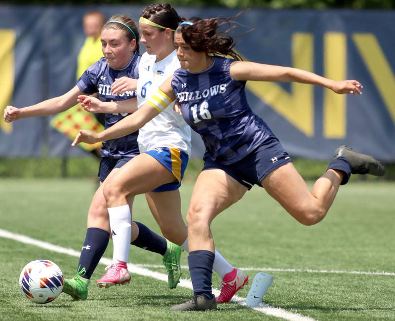 Johnsburg’s Liz Smith, center, is sandwiched between Willows Academy’s Sophia Duffy, left, and Maria Rodriguez, right, in IHSA Class 1A Supersectional soccer action at Dominican University in River Forest on Saturday, May 31, 2025.