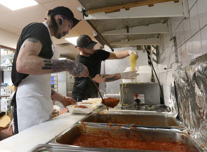 Cooks Zak Byrnes and Steve Jensen prepare spaghetti during the 24th annual Lighted Way Spaghetti dinner on Monday, March 27, 2023 at Uptown in La Salle.