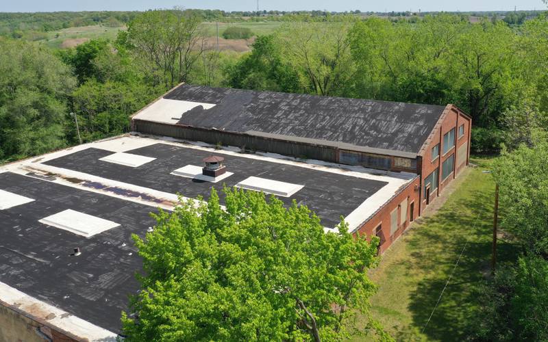 An aerial view of the Apollo Warehouse that once stored the potassium permanganate chemical that Carus Chemical produced at the end of Porter Street on Thursday, May 11, 2023 in La Salle.