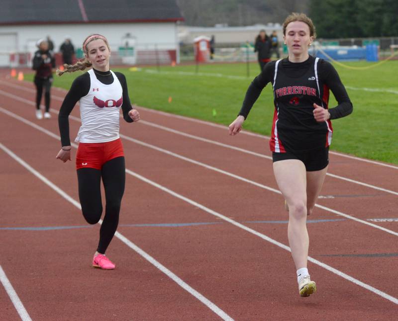 Forreston's Bree Schneiderman (right) won the 400 meters and Oregon's Grace Tremble (left) placed second at the Landers-Loomis Invitational track meet on Friday, April 25, 2025 held at Oregon High School. Schneiderman won the race in 1:01.62.