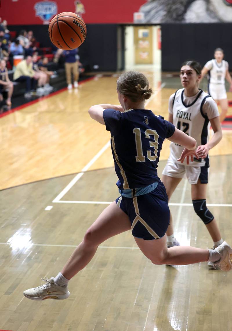Marquette's Emily Ryan-Adair saves the ball from going out-of-bounds in front of Rockford Christian's Josie Becker Tuesday, Feb 24, 2026, during their Class 1A sectional semifinal game at Indian Creek High School in Shabbona.