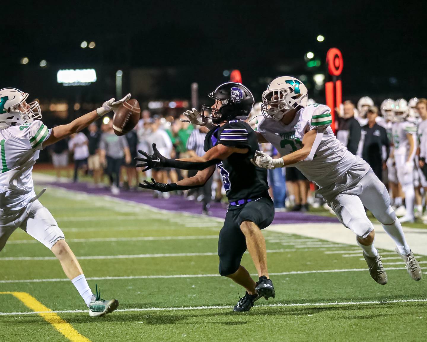 Downers Grove North's Owen Thulin (5) makes a catch on  a perfectly thrown pass during football game between York at Downers Grove North.  Sept 29, 2023.