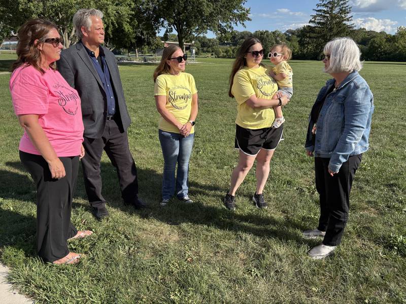 A total of $14,000 was awarded this week to two nonprofits by organizers of the Run Today for Tomorrow (RTFT) 5K Run/Walk in Ottawa. Pictured are RTFT’s Renee Durdan, left, Youth Service Bureau Executive Director Sam Tenuto, RTFT’s Katie Fleming, organizer Emily Hardee with 18-month-old daughter Peyton, and North Central Behavioral Health Systems’ Angie Hughes. The YSB and NCBHS each received $7,000 in proceeds from the race.