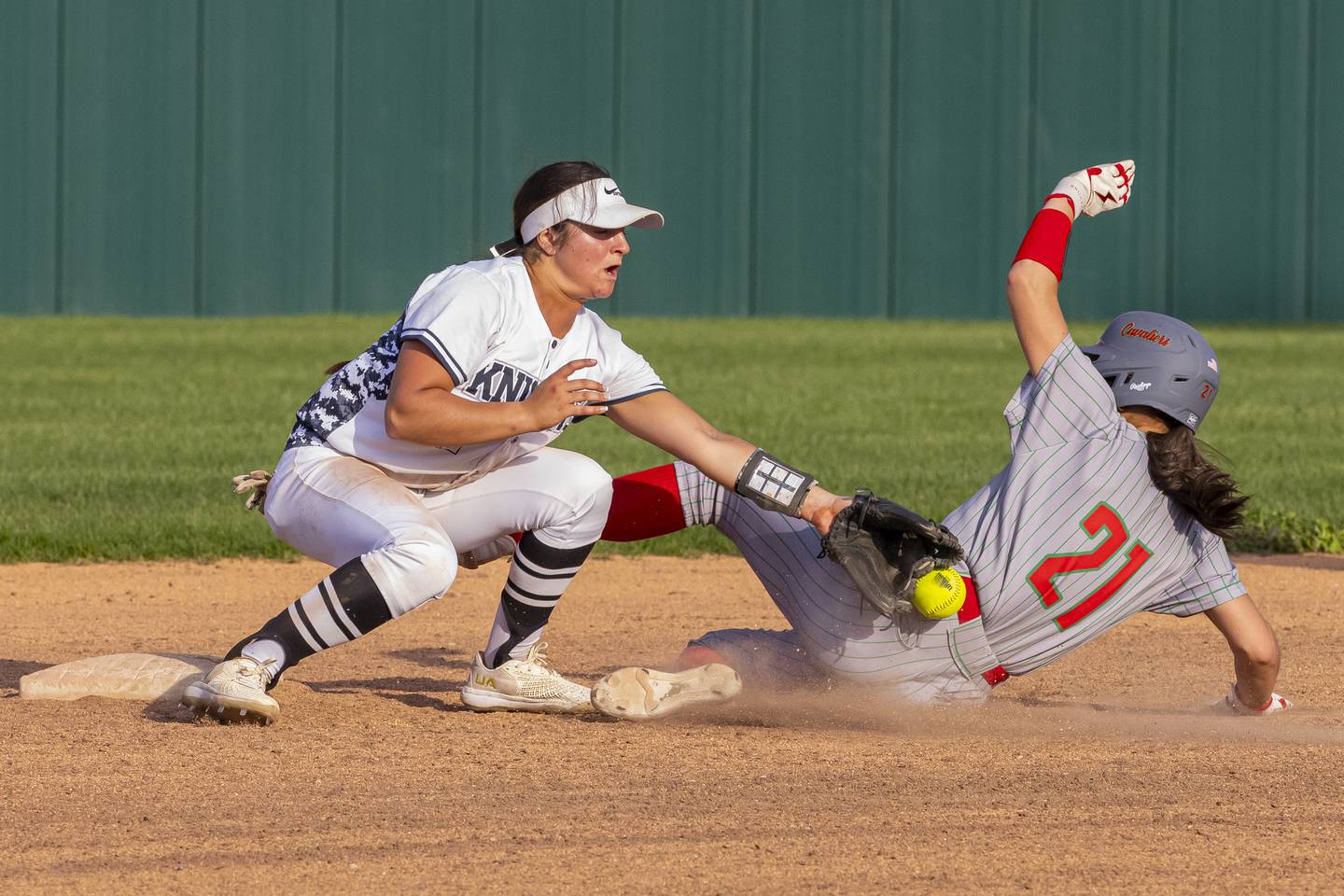 Anna Riva of LaSalle Peru High School is stuck in the back by a throwdown to second base and was called safe during the ballgame on April 28, 2025 at the LaSalle Peru High School Sports Complex.