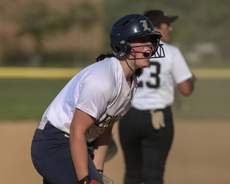 Lemont's Natalie Pacyga (18) gets pumped up during Class 3A Joliet Catholic Sectional final game between Marian Catholic at Lemont.  June 3, 2022.